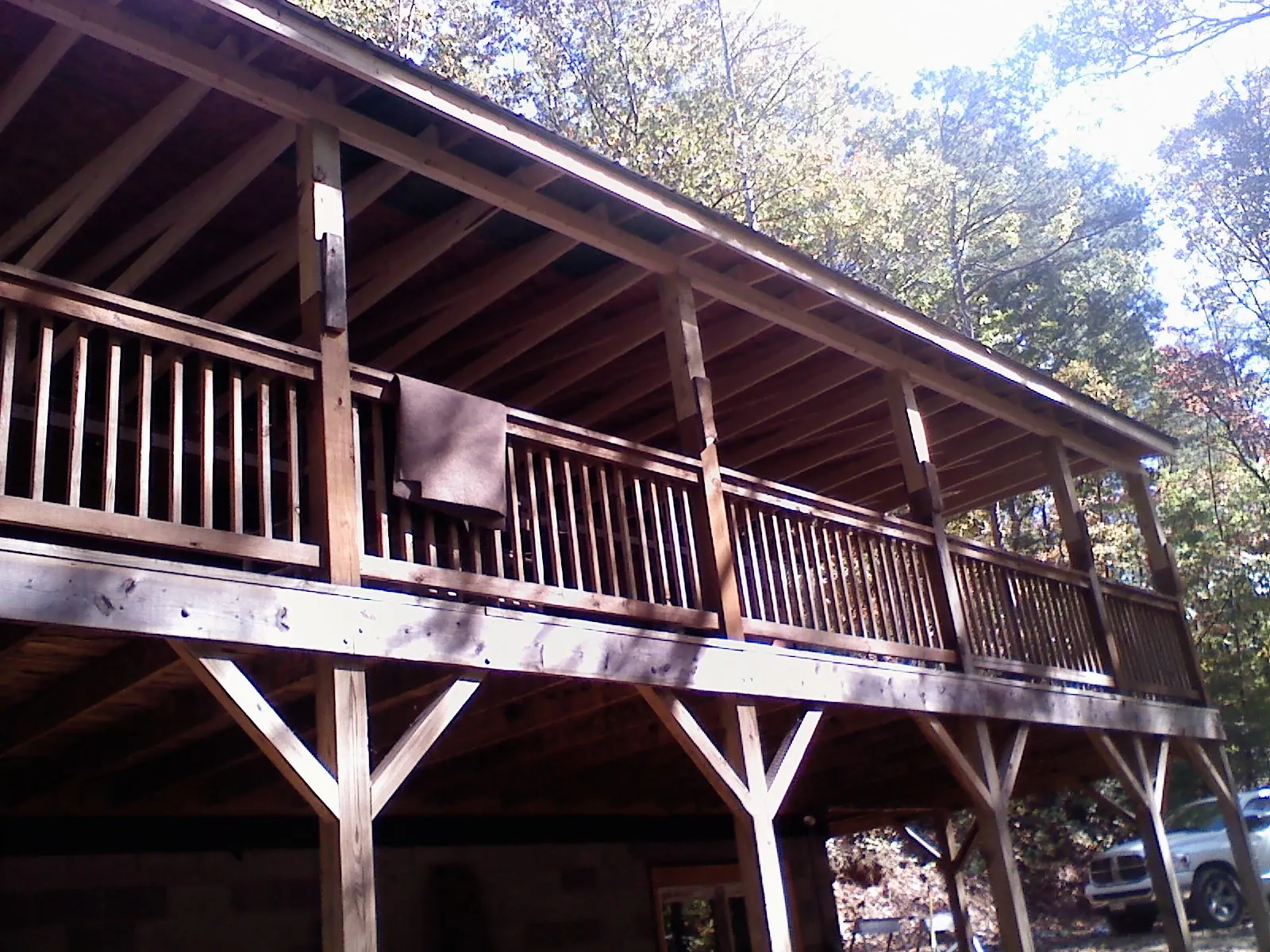 Timber framing under a new elevated porch and deck — Roof Leak Repair in Peoa by Roofing Brothers
